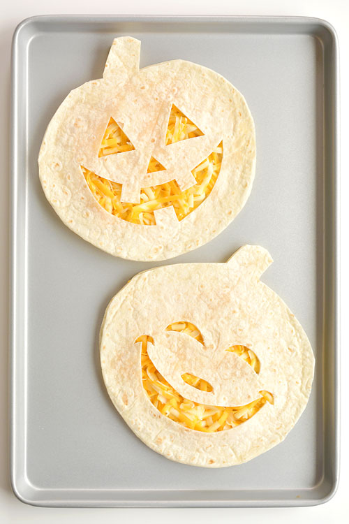 These jack-o-lantern cheese quesadillas are SO FUN and so simple to make! They're such a fun and easy Halloween food idea and would be great as an easy Halloween dinner! Not to mention they're fantastic for picky eaters! 