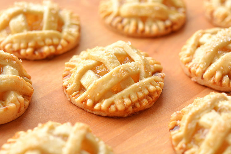 These mini apple pies are SO GOOD! There's nothing like warm apple pie, with a delicious flaky crust and that gooey, sweet apple filling. These delicious fall treats will disappear fast!