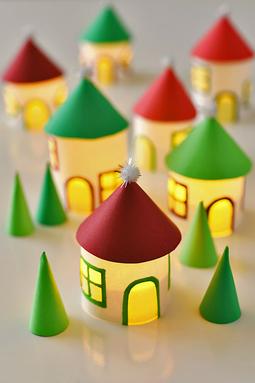 This paper roll Christmas village is SO CUTE and it's really easy to make! Add a few battery operated tea lights and you can create a magical glowing village. This is such a cute Christmas decoration and a super fun Christmas craft to make with the kids.