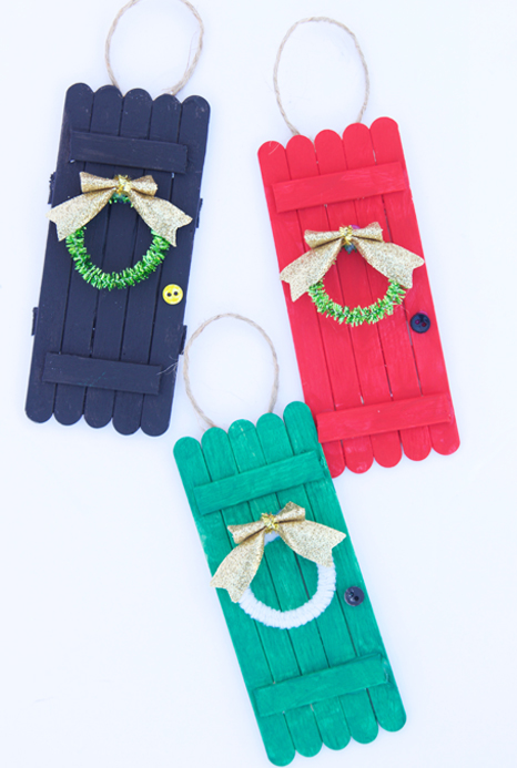 These popsicle stick door ornaments are SO cute and such an easy kids ornament craft to make!