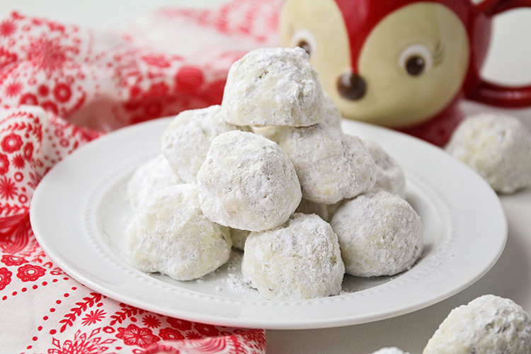 These melt-in-your-mouth delicious snowball cookies are so easy to make and only have six ingredients! They are the perfect holiday cookie!