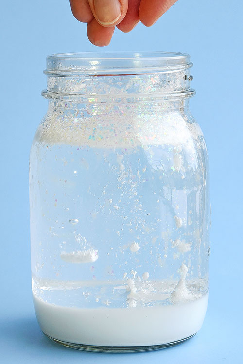 This snowstorm in a jar is such a fun winter science experiment! It's really easy to put together and it looks so cool when it starts "snowing"! It uses simple materials and it's a great way to learn about weather, density and other cool science topics!