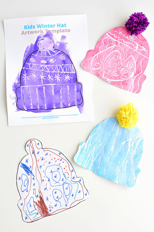 This winter hat art project for kids is such a fun winter craft idea! Use the free printable winter hat template to have a fun day of crafting at home or in the classroom! This process art idea lets you experiment with creating texture in watercolor and shows the magic of painting over crayon with watercolour paint! There's even instructions for making a DIY yarn pom pom!