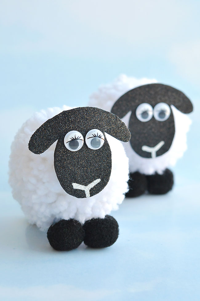 These pom pom sheep are SO CUTE and they're really simple to make! It's so easy to make DIY pom poms from yarn just by using your hands! This is such a fun kids craft for spring, or even Easter! I love that it uses such simple craft supplies. Pom pom crafts are the best!