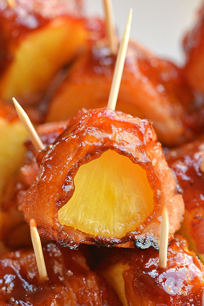 These bacon wrapped pineapple bites are SO GOOD!! And they're so easy to make! This is such an easy appetizer and a great three ingredient recipe that you can throw together at the last minute. The bacon and the pineapple taste sooooo good together! Mmmm... bacon!