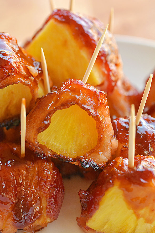 These bacon wrapped pineapple bites are SO GOOD!! And they're so easy to make! This is such an easy appetizer and a great three ingredient recipe that you can throw together at the last minute. The bacon and the pineapple taste sooooo good together! Mmmm... bacon!