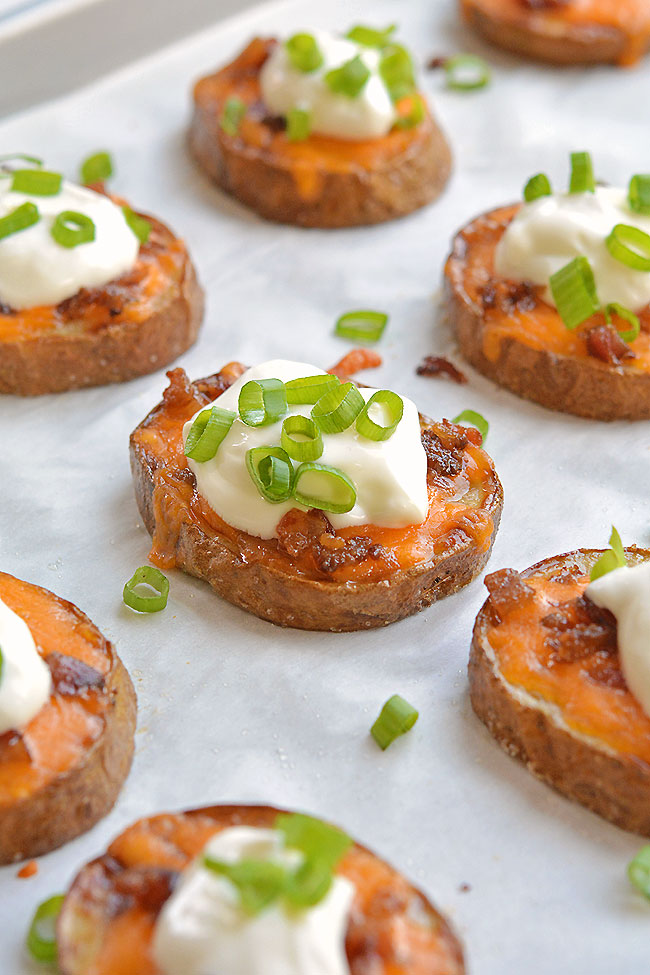 These easy baked potato skins are SO GOOD. This is such a great appetizer recipe! So simple to make and they taste amazing. They're like little bites of loaded baked potatoes. Serve them warm with your favourite baked potato toppings. They make a great game day snack, an easy appetizer and a great dinner side dish. Such a yummy recipe!