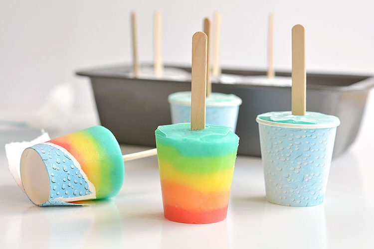 Rainbow colored popsicles made in Dixie cups
