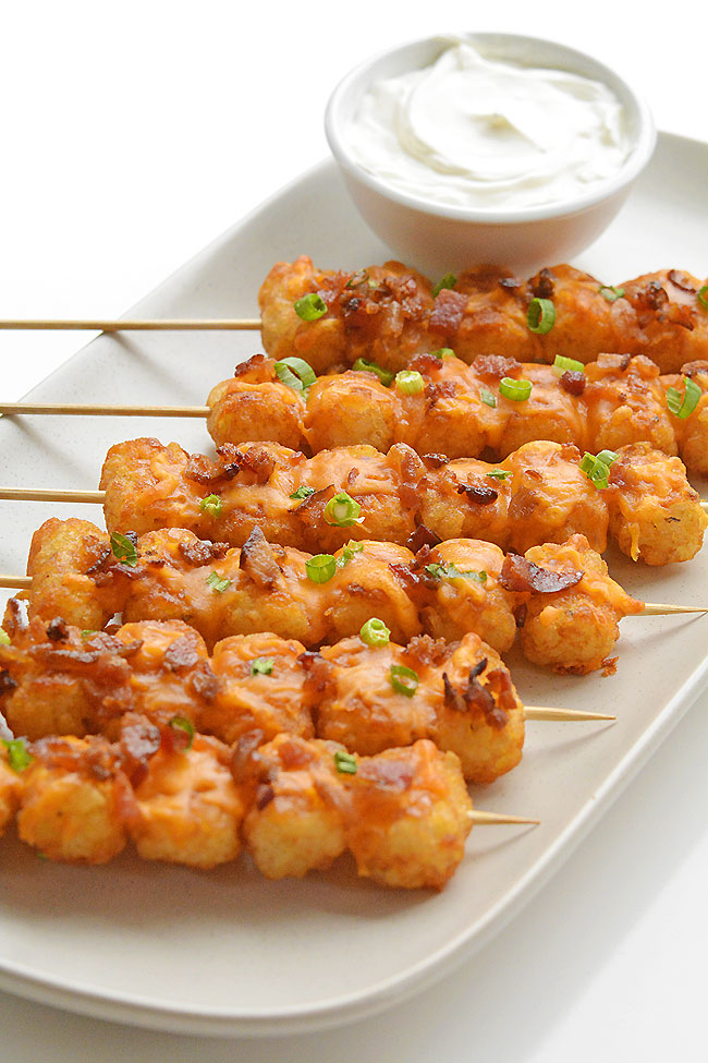 These loaded tater tot skewers are so delicious and they're really easy to make! This is such an easy appetizer recipe! It's great for game day and parties but it also makes a fun side dish for dinner. Loaded with cheese and bacon these are soooo good!