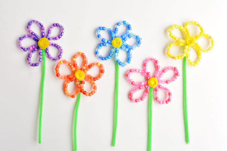 Four colours of beaded pipe cleaner flowers