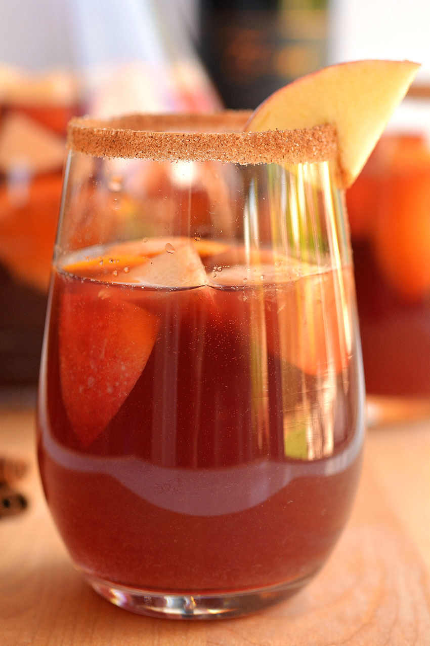 This recipe for autumn sangria is SO GOOD! Infused with apples and cinnamon, this simple red wine sangria recipe is fruity, festive and tastes delicious!
