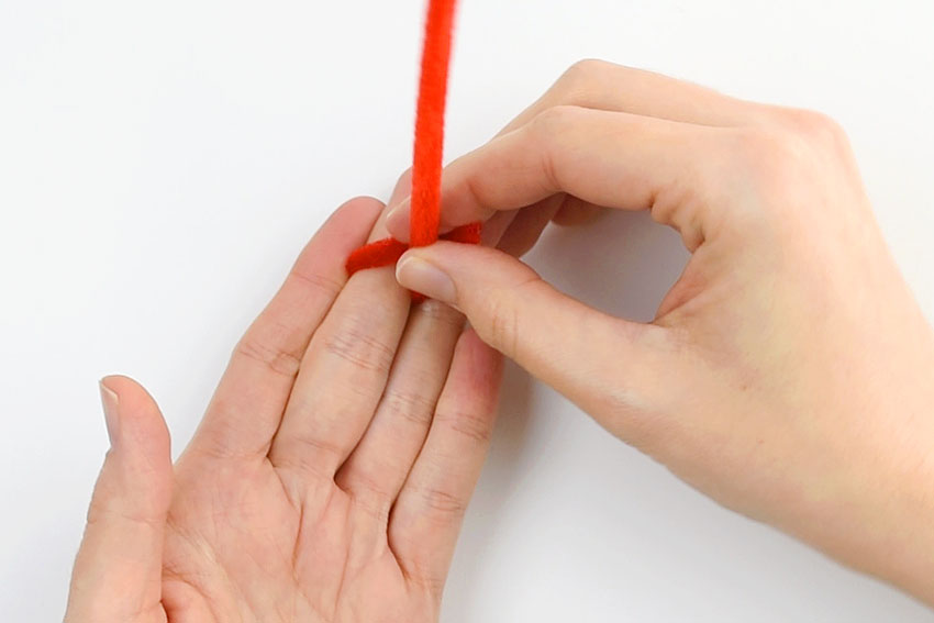 Pipe cleaner twisted around finger