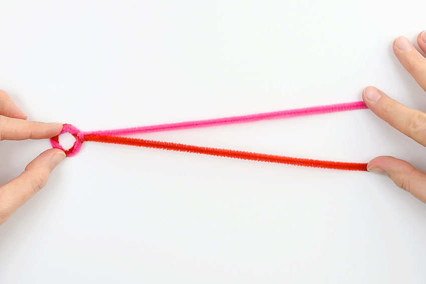 Two pipe cleaners with a twisted loop at the end