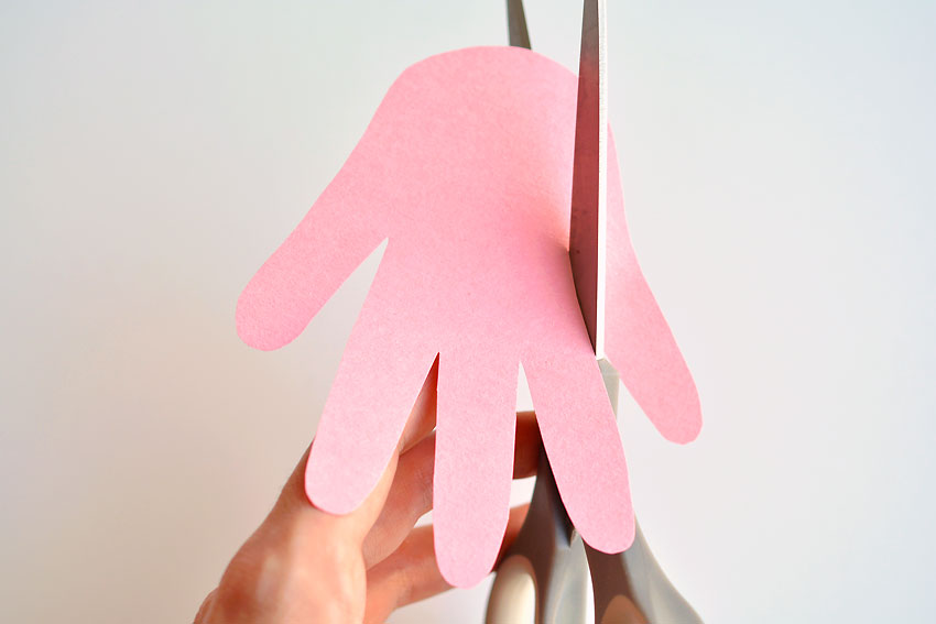 Paper Handprint Bunnies - Cut a slit beside the pinky finger