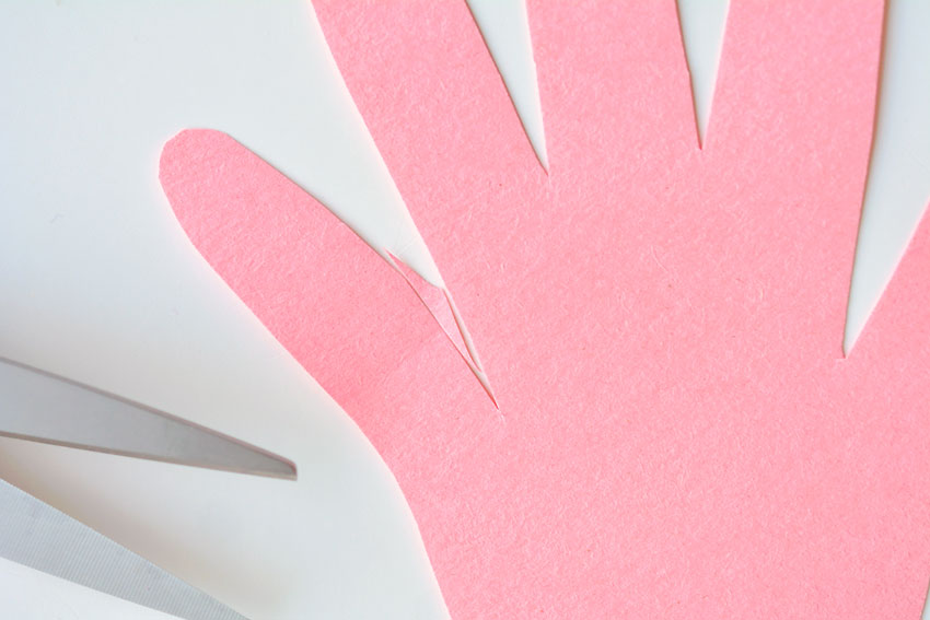 Paper Handprint Bunnies - Trim the pinky finger for symmetry