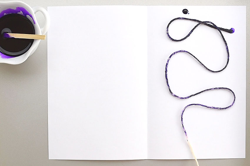 String laying on white paper