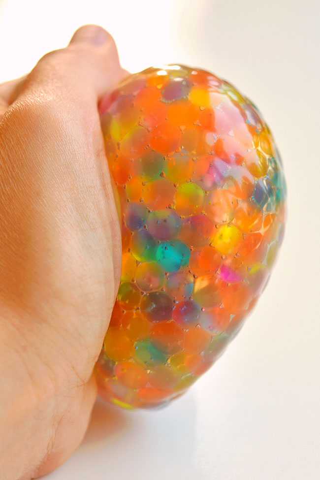 Stress ball orbeez being squeezed