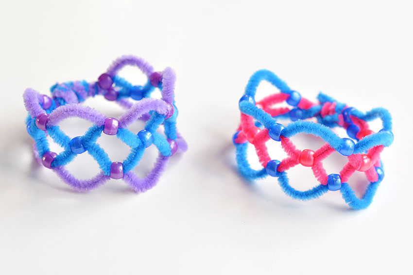 Two pipe cleaner bracelets on a white background