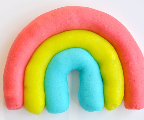 Homemade playdough formed into a rainbow