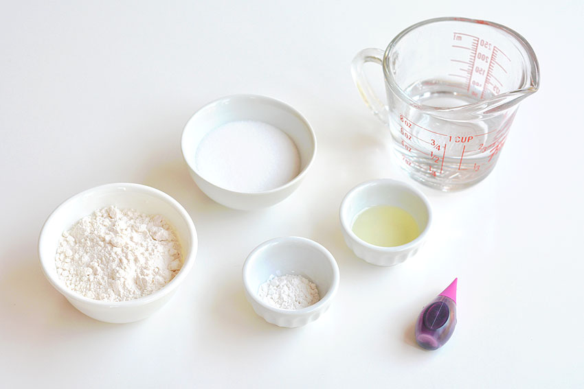 Ingredients for playdough recipe on a white table
