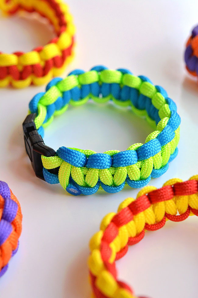 Several paracord bracelets on a white background