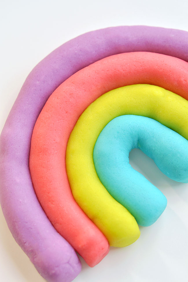 Coloured playdough formed into a rainbow