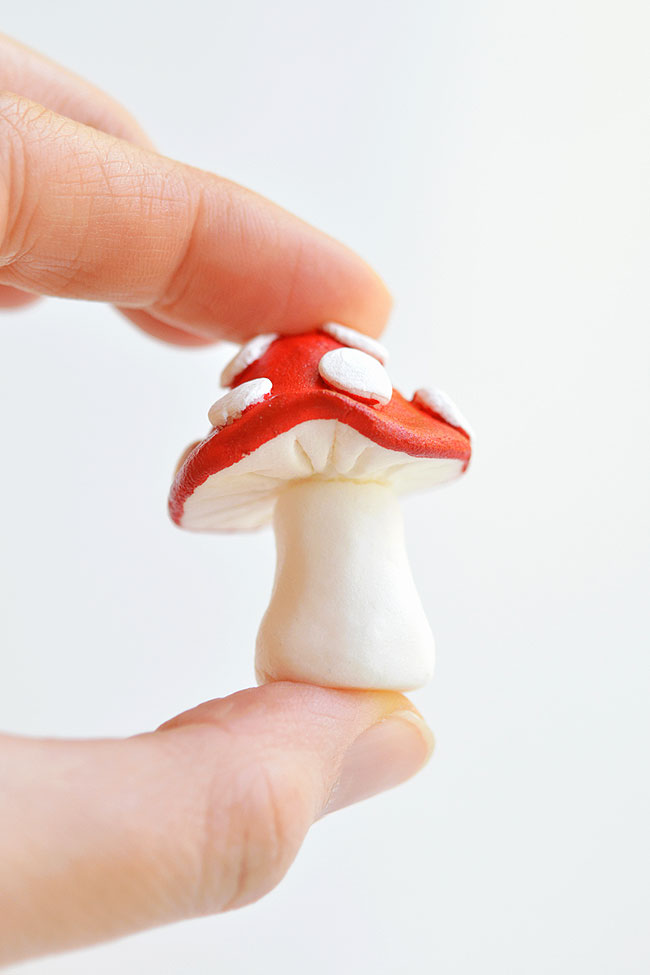 Clay mushroom held in fingertips