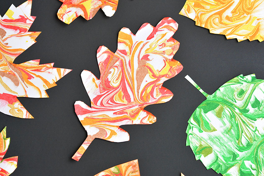 Paper marbling cut into fall leaf shapes
