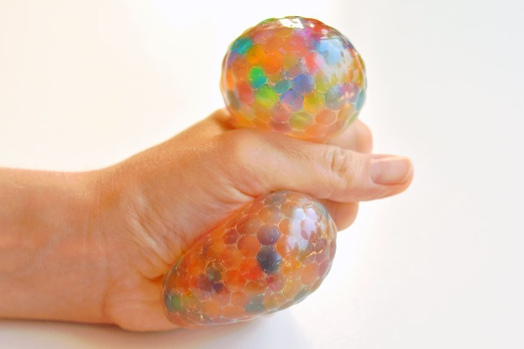 Stress ball with Orbeez being squeezed