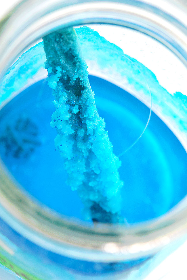 Popsicle stick in mason jar with blue table salt crystals