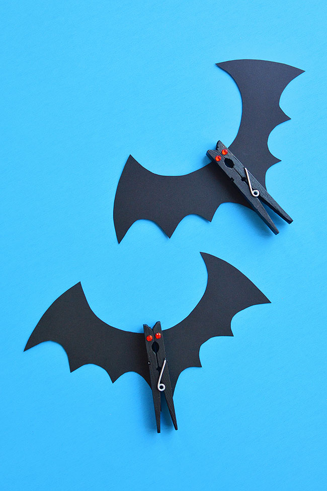 Clothespin bats on a blue background