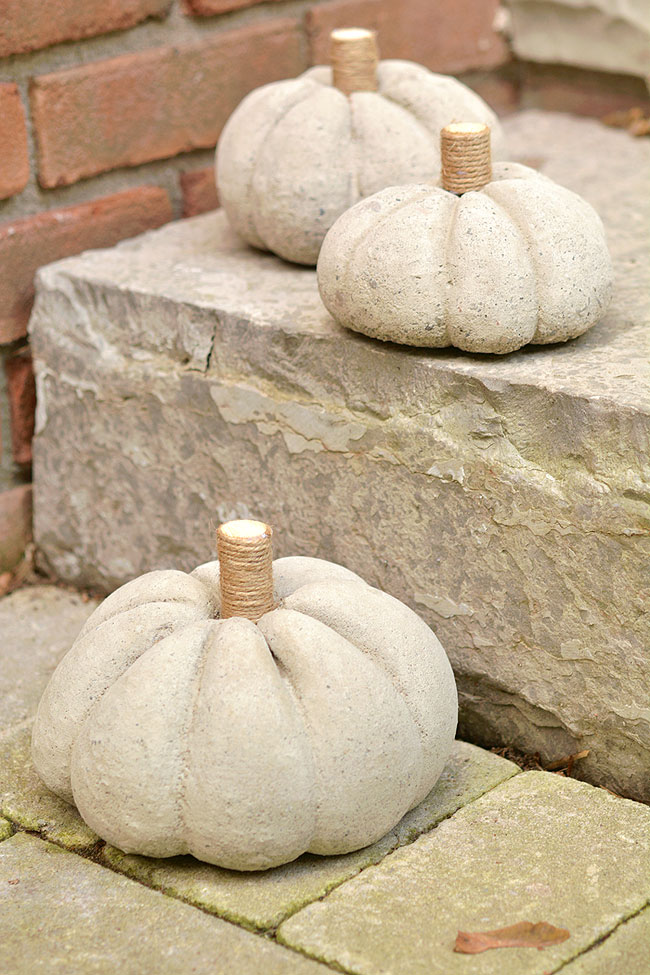 DIY concrete pumpkins on steps outside
