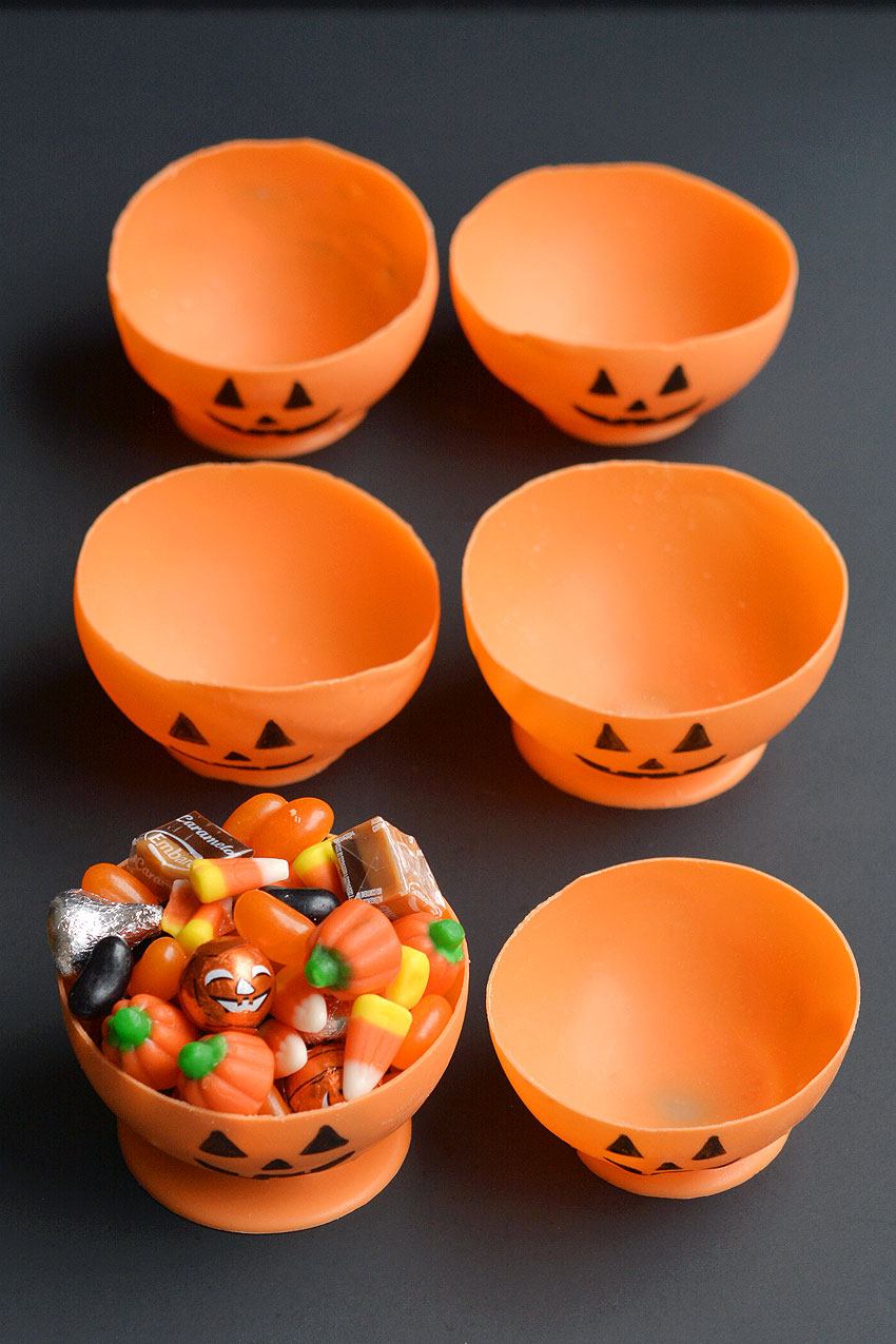 Group of edible jack-o-lantern candy cups