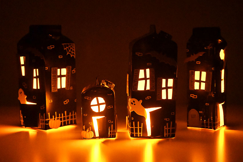 Milk carton haunted house craft lit up in the dark