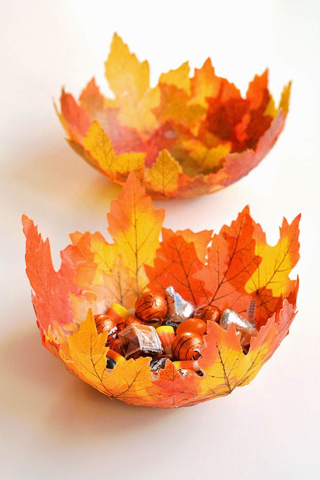 Two leaf bowls, one filled with candy