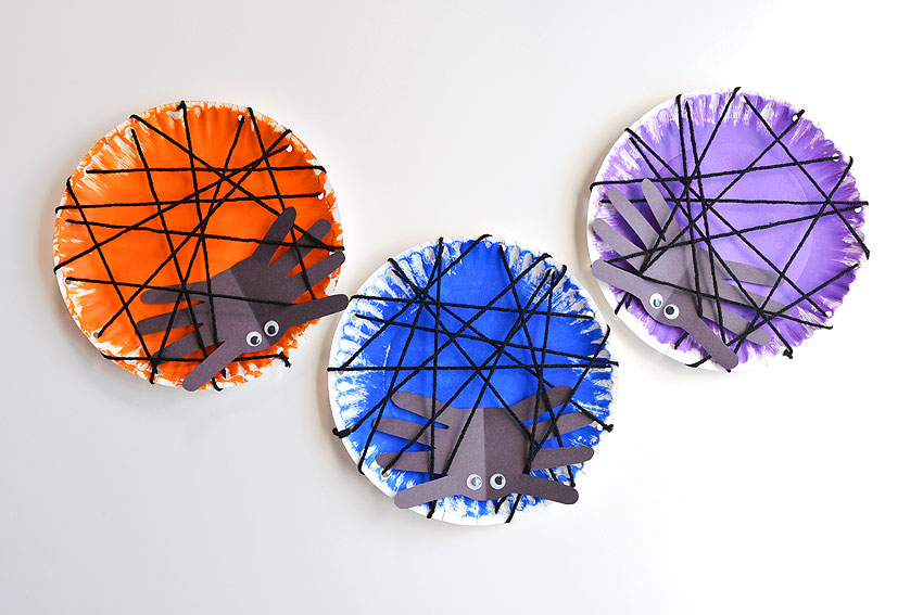 Orange, blue and purple spider handprint crafts