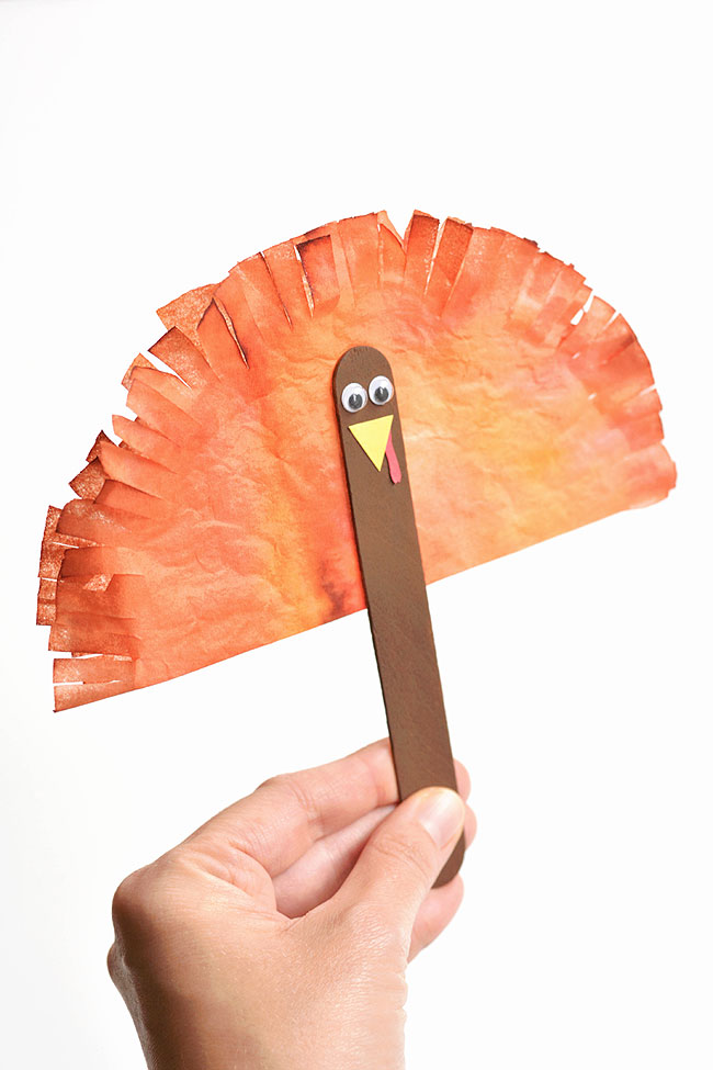 Coffee filter turkey held as a puppet