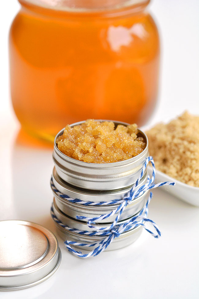 Stacked homemade lip scrub with a honey jar in the background