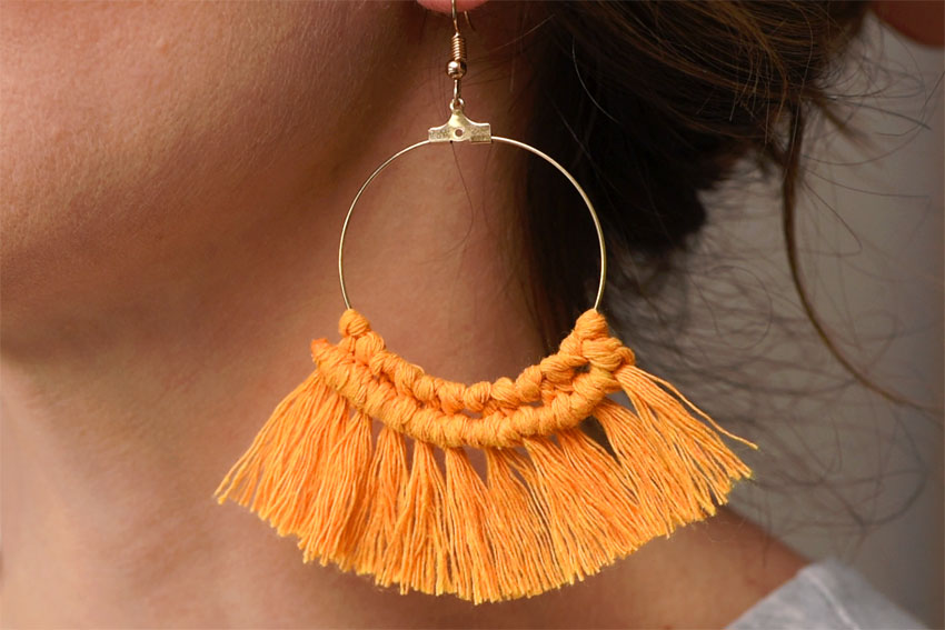 Side profile of a DIY macrame earring being worn
