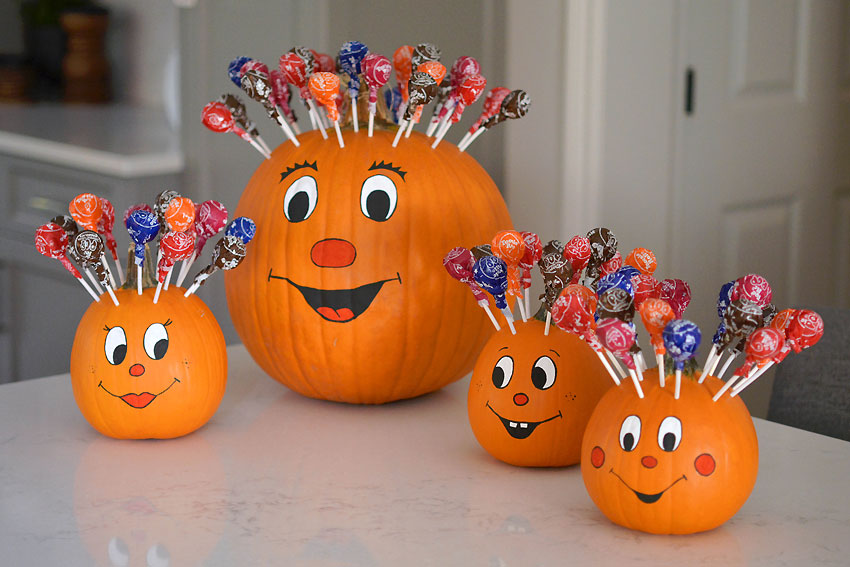 A family of four pumpkins with lollipop hair