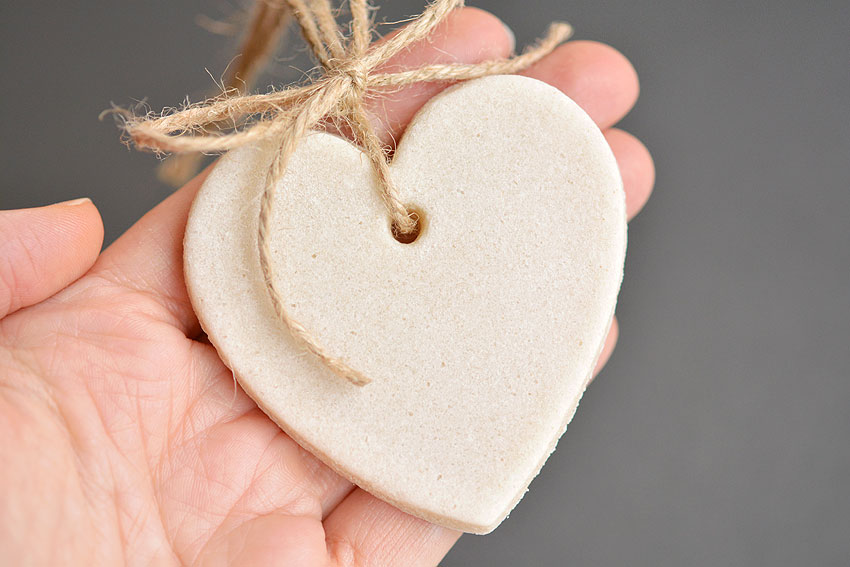 Heart shaped salt dough ornament held in hand