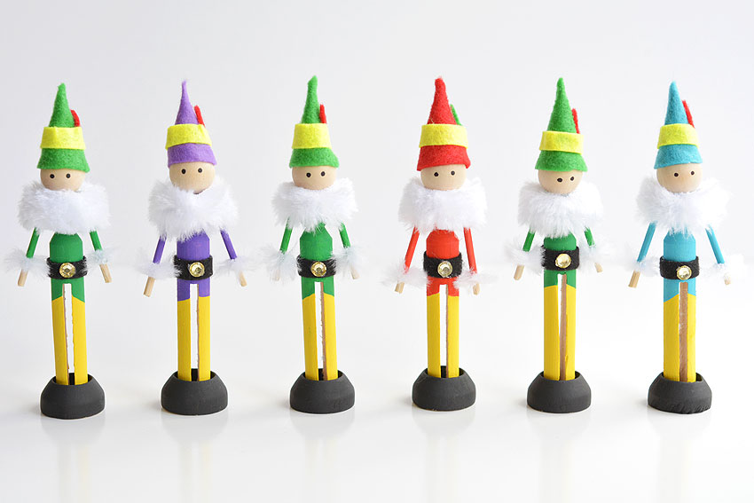 Clothespin elves standing in a row