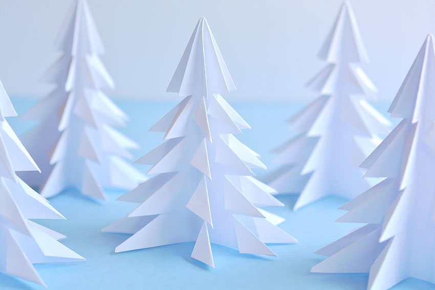 A forest of Christmas trees folded and cut from paper