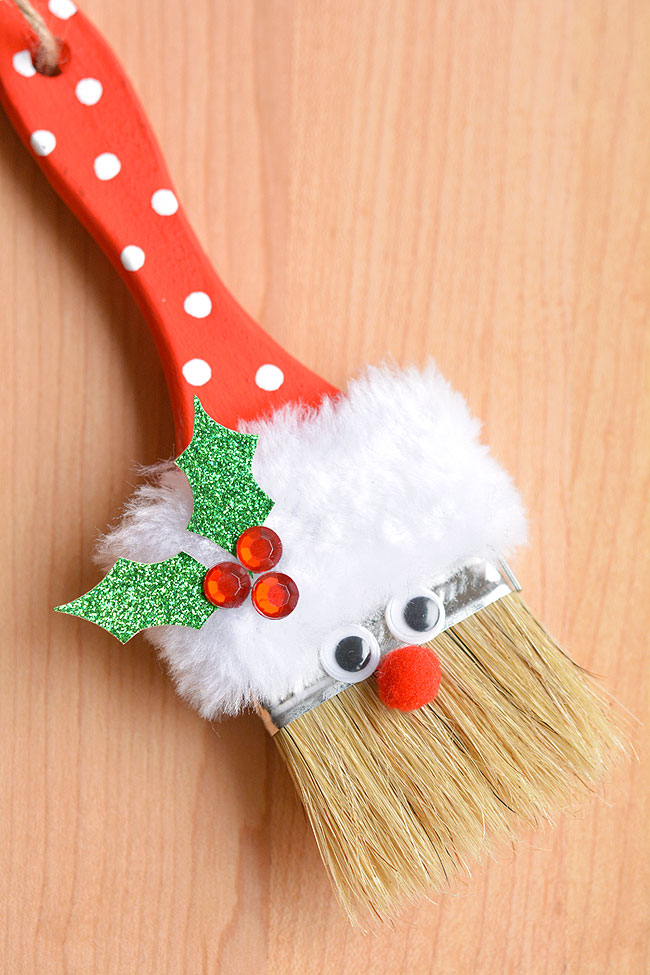 Santa paint brush ornament on a wooden background