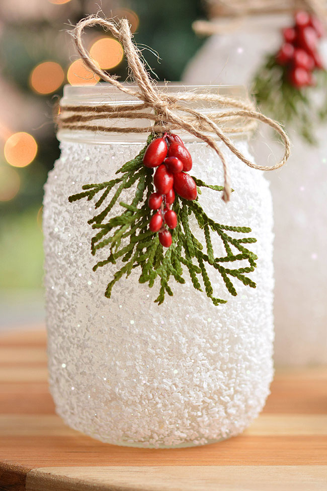 Snowy mason jar decorated for Christmas