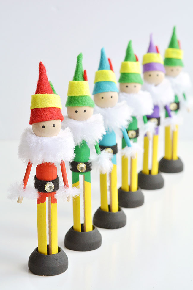 Wood peg elves standing in a row
