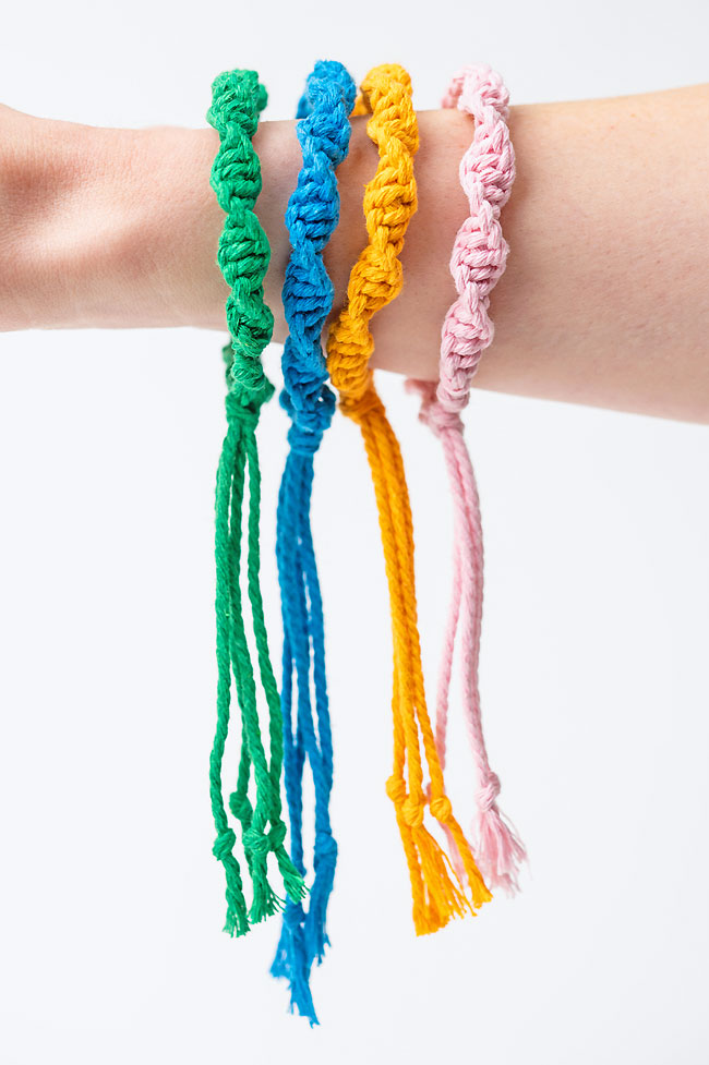 Macrame bracelets dangling from a wrist