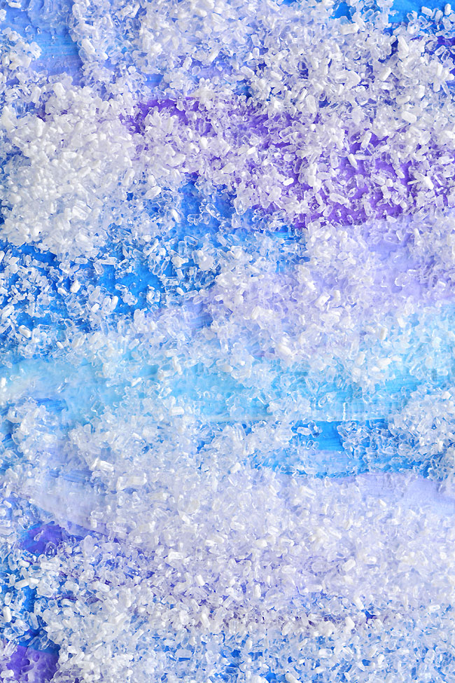 Closeup on a blue and purple coloured snowy painting
