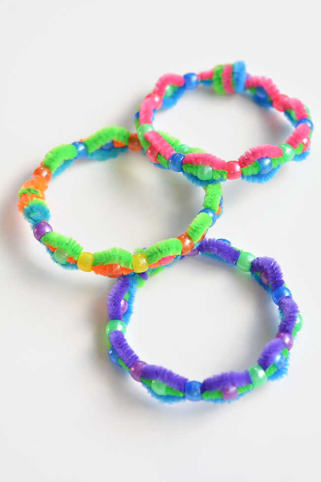 Pipe cleaner bead bracelets on a white background