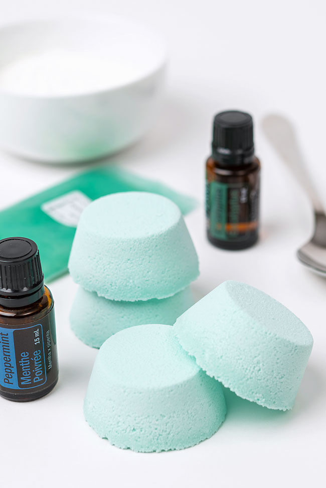 Homemade shower tablets surrounded by ingredients to make the recipe